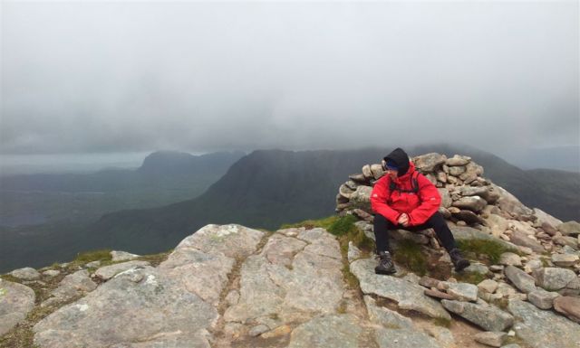 On the summit of Cul Beag, trying to look relaxed in storm force winds
